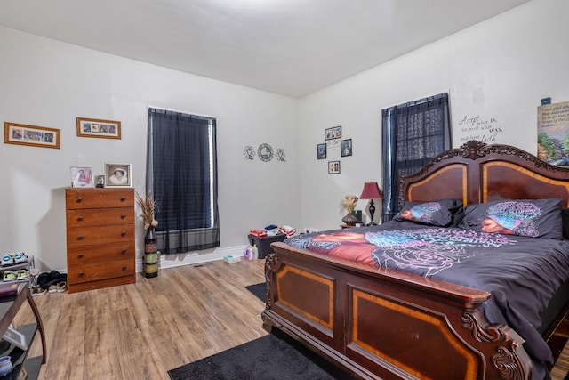 bedroom featuring wood finished floors