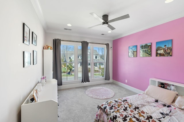 carpeted bedroom featuring visible vents, ornamental molding, a ceiling fan, and baseboards