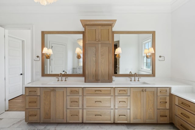 bathroom with double vanity, a sink, and crown molding