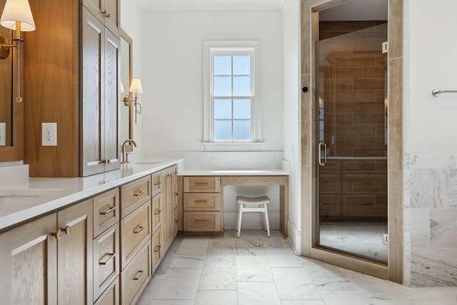 full bath featuring a sink, marble finish floor, a shower stall, double vanity, and crown molding