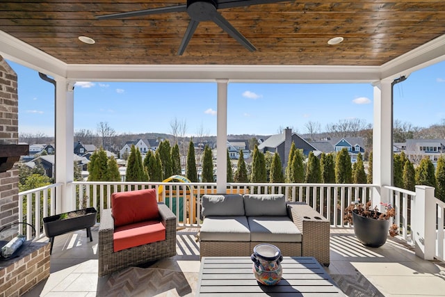 exterior space with an outdoor hangout area and a ceiling fan