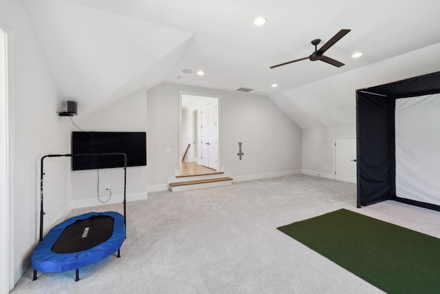 interior space featuring golf simulator, recessed lighting, visible vents, carpet flooring, and vaulted ceiling