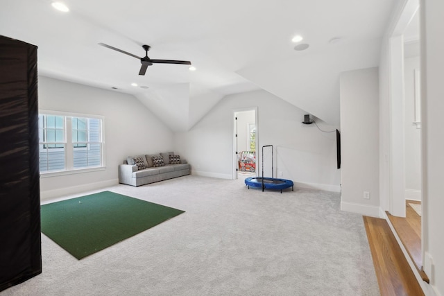 interior space with a healthy amount of sunlight, baseboards, and vaulted ceiling