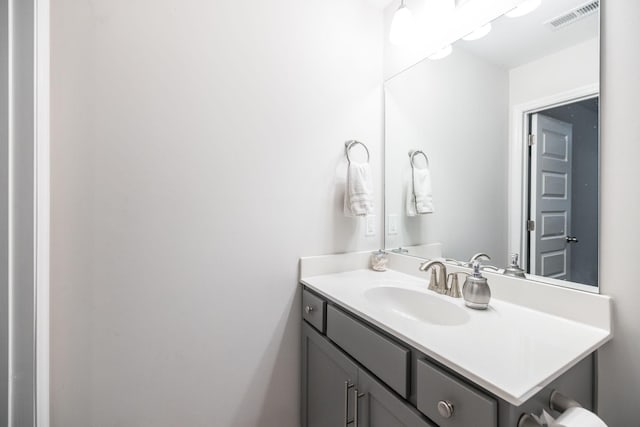 bathroom featuring visible vents and vanity