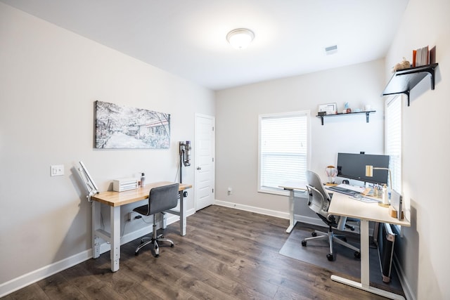 office featuring wood finished floors, visible vents, and baseboards