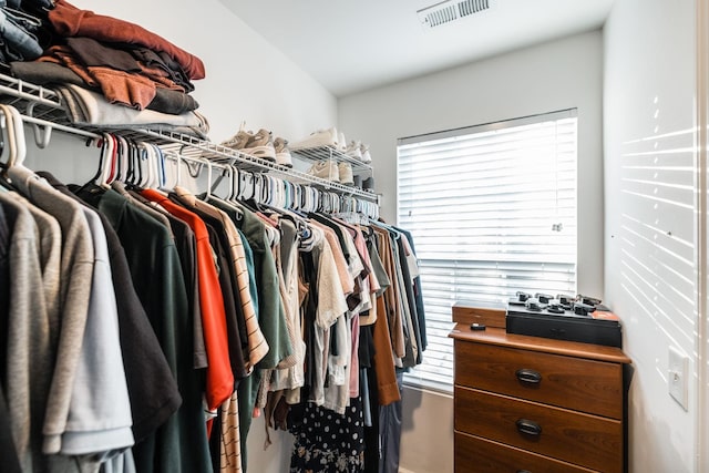 spacious closet featuring visible vents