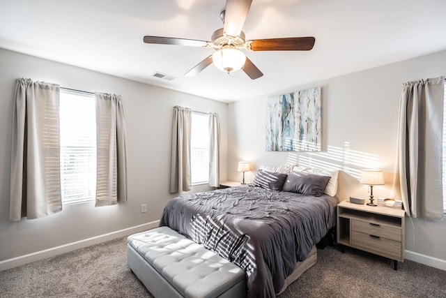 bedroom featuring carpet, visible vents, baseboards, and ceiling fan