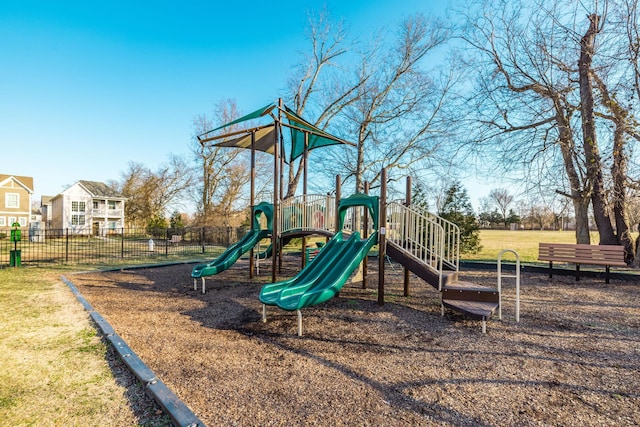 communal playground featuring fence