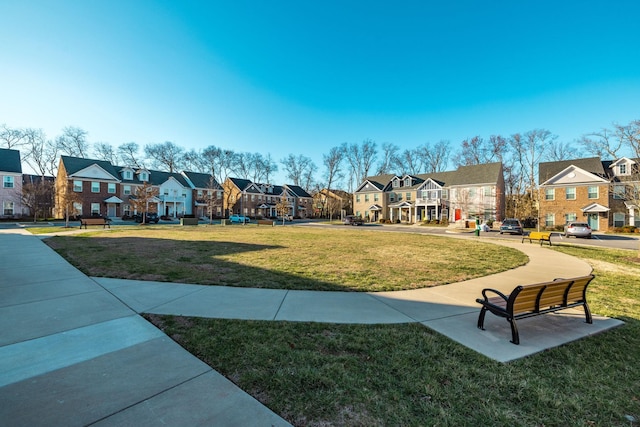 view of community with a residential view and a lawn