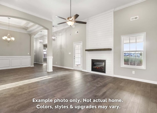 unfurnished living room with ornamental molding, visible vents, plenty of natural light, and a fireplace