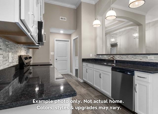 kitchen with crown molding, appliances with stainless steel finishes, visible vents, and white cabinets