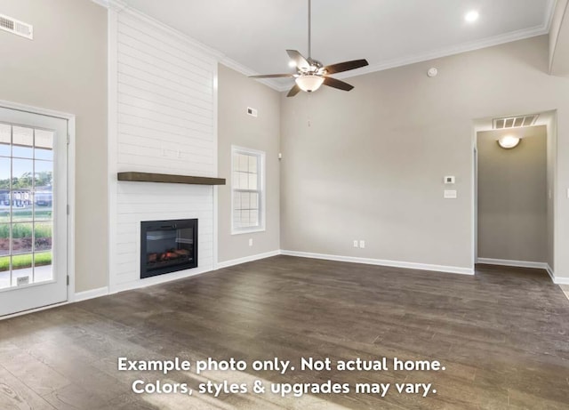 unfurnished living room featuring visible vents, a wealth of natural light, and ornamental molding