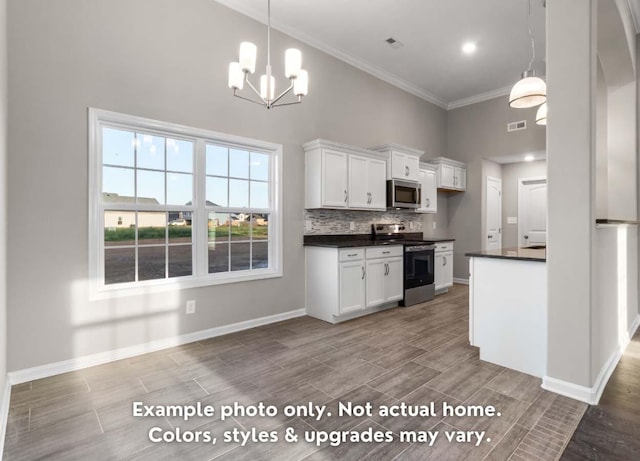 kitchen with appliances with stainless steel finishes, dark countertops, decorative backsplash, and wood tiled floor