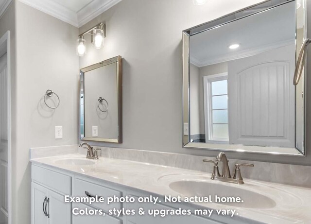 full bathroom with double vanity, a sink, and crown molding