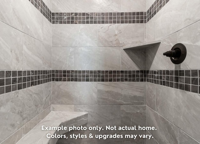 room details featuring tiled shower