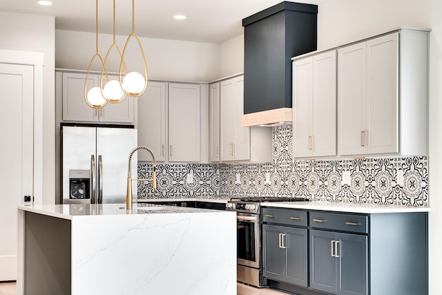 kitchen featuring decorative backsplash, light stone countertops, custom exhaust hood, stainless steel appliances, and a sink