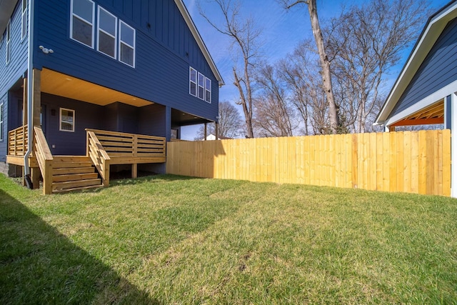 view of yard with fence and a wooden deck