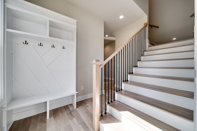 mudroom featuring baseboards, wood finished floors, and recessed lighting