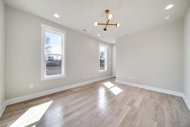 unfurnished room with plenty of natural light, visible vents, and recessed lighting