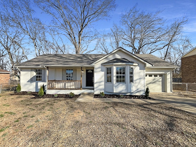 ranch-style home with covered porch, fence, an attached garage, and concrete driveway