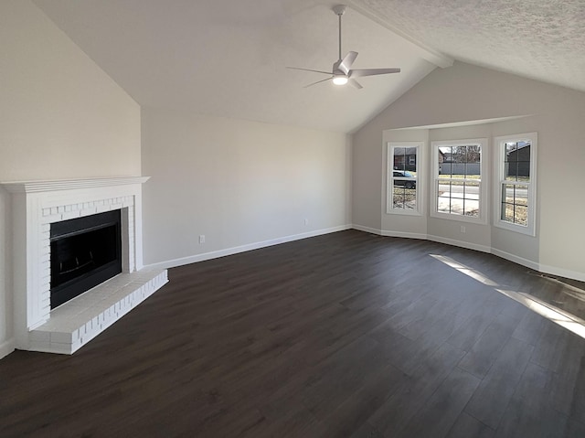 unfurnished living room featuring baseboards, a ceiling fan, lofted ceiling with beams, dark wood-type flooring, and a fireplace