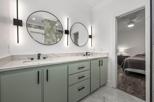 full bathroom featuring connected bathroom, marble finish floor, a sink, and double vanity