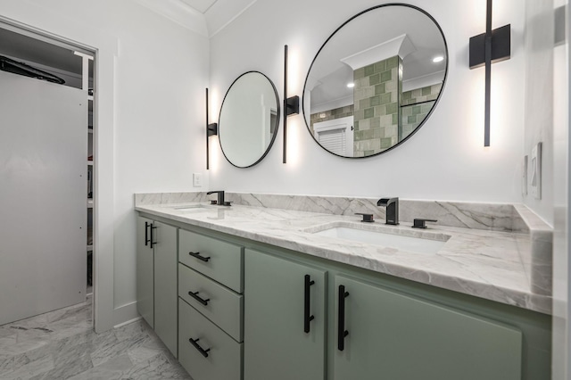 bathroom with marble finish floor, a sink, and double vanity