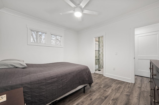 bedroom featuring ensuite bathroom, ceiling fan, wood finished floors, baseboards, and ornamental molding