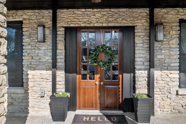 view of exterior entry with stone siding