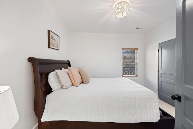 bedroom featuring visible vents