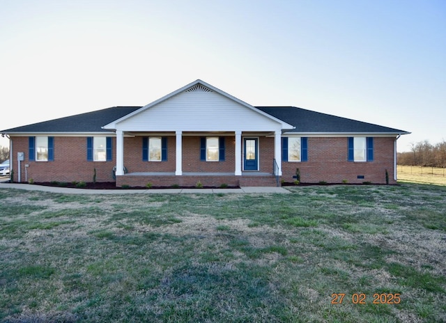 ranch-style home with covered porch, brick siding, crawl space, and a front yard