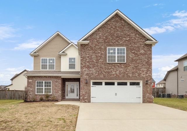 traditional home with a garage, brick siding, fence, driveway, and a front lawn