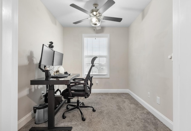 office area featuring ceiling fan, carpet flooring, and baseboards