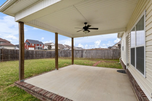 view of patio / terrace featuring ceiling fan, a fenced backyard, and a residential view