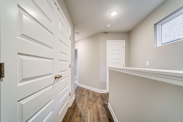 hall featuring dark wood-style floors and baseboards