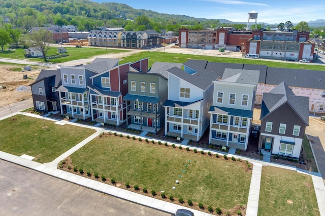 drone / aerial view with a residential view and a mountain view