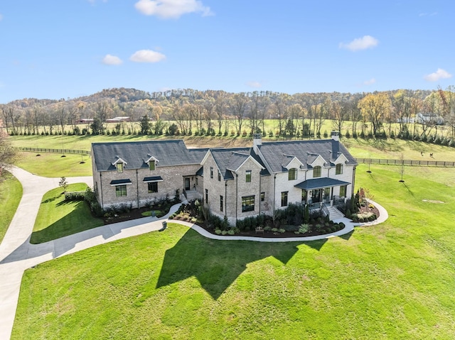 drone / aerial view featuring a view of trees