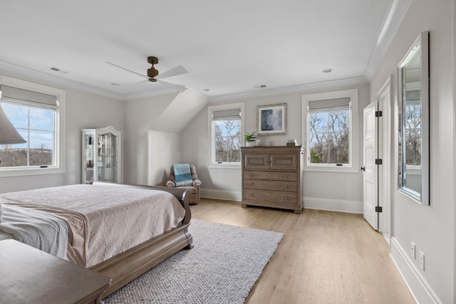 bedroom with visible vents, baseboards, light wood-style floors, a ceiling fan, and crown molding