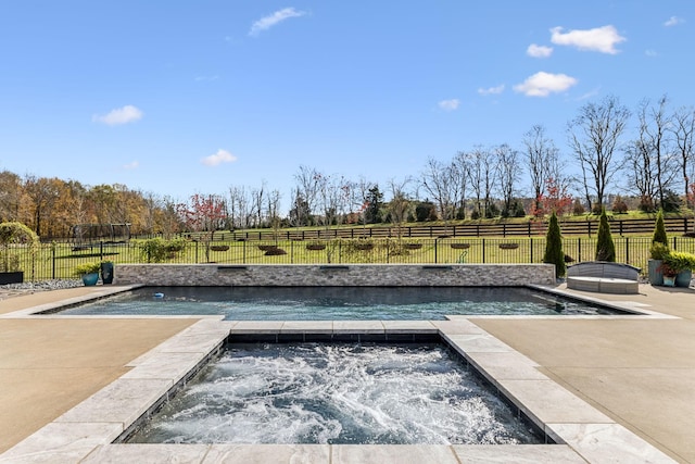 view of pool featuring a fenced in pool, a fenced backyard, and an in ground hot tub