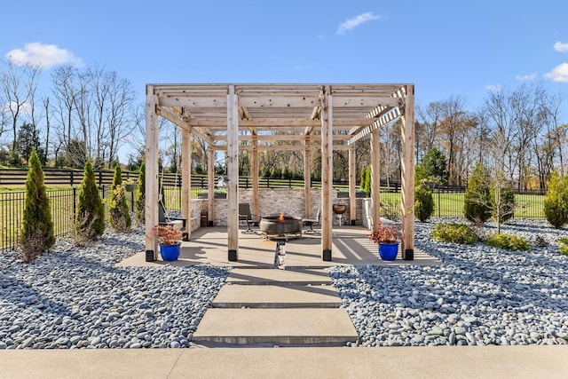 view of patio with an outdoor fire pit, a fenced backyard, and a pergola