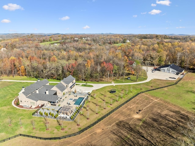 bird's eye view featuring a wooded view