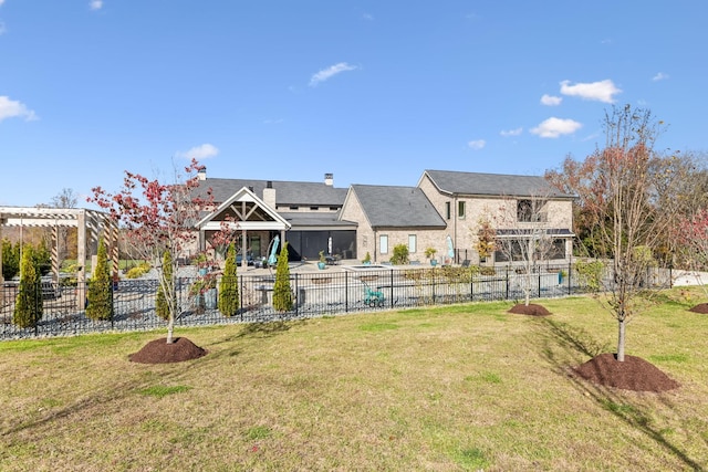 back of property featuring a chimney, a lawn, a patio, and fence