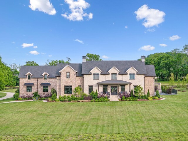 6599 Owen Hill Rd, College Grove, TN 37046 - french country inspired facade with a chimney and a porch