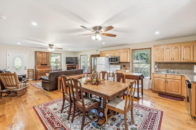 dining area with ceiling fan, light wood finished floors, and recessed lighting