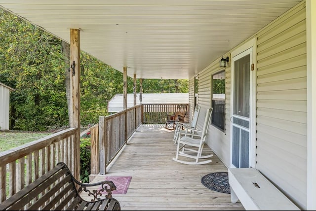 wooden deck featuring a porch