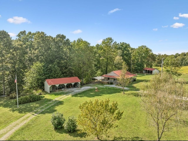 birds eye view of property with a wooded view