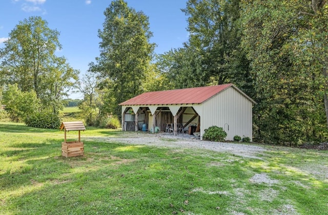 view of yard with an outbuilding and a detached garage