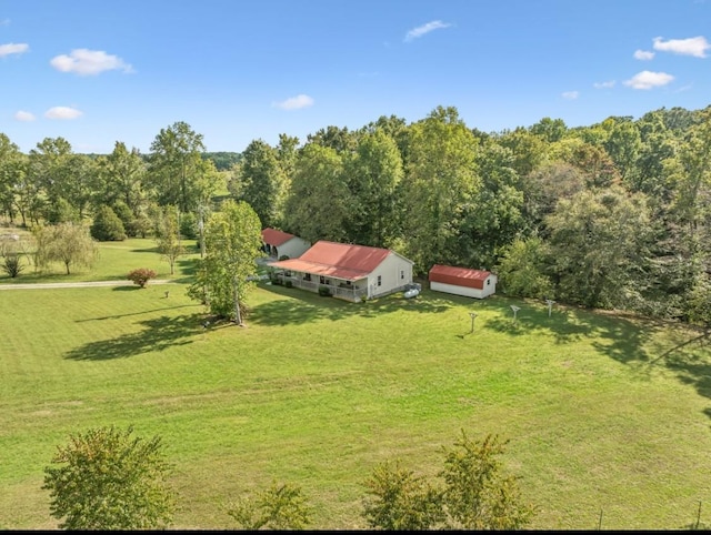 aerial view featuring a wooded view