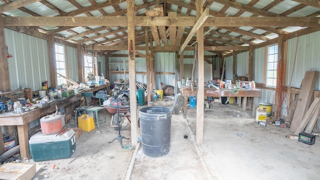 misc room featuring lofted ceiling and a workshop area