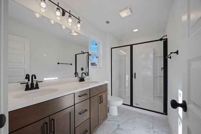 full bath with marble finish floor, a sink, and a shower stall